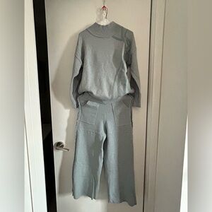 Women’s autumn/winter knit pants and sweater matching set in powder blue.